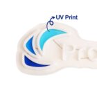 A logo with stylized blue crescent shapes and white text on a light background, featuring an arrow labeled UV Print pointing to the outer crescent.