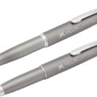 Two gray pens with Helix Capital branding. One pen has a ballpoint tip and the other a stylus tip. Both have silver clips and a sleek metallic finish, positioned side by side on a white background.