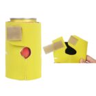 A yellow drink holder with a Velcro closure and a cutout showing an orange interior. A hand is holding the detached piece next to the holder, showcasing its adjustable design. A can of soda is inside the holder.