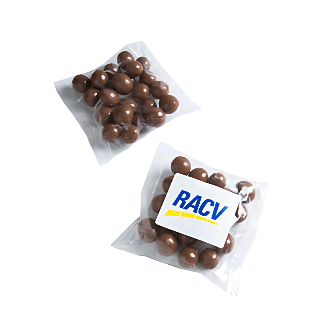 Two 50g clear bags of Choc Coffee Beans, a delicious chocolate-covered treat, one with an RACV logo, are displayed on a plain white background—ideal for any event.