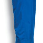 Side view of a pair of royal blue pants with an elastic waistband and a slightly tapered leg. The material appears smooth and lightweight. There is a small slit at the bottom of the leg.