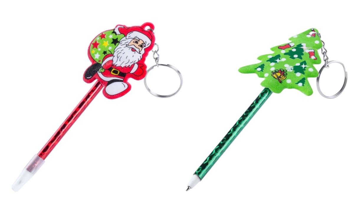 Two festive keychain pens: one red pen with a Santa Claus decoration and one green pen with a Christmas tree decoration. Both feature metallic patterns and have small key rings attached to the top.