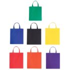 Seven tote bags in various colors are arranged in a grid on a white background. The colors from top to bottom, left to right are green, blue, black, yellow, red, orange, and purple. Each bag has two handles.