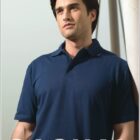 A person in a navy blue polo shirt leans against a wall, looking to the side. The words BOCINI and CASUAL are written on the image.