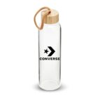 A transparent glass water bottle with a wooden lid and a cord loop. It features a black Converse logo, incorporating a star and arrow design, on the front.