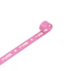 Pink ribbon unrolling with the text Birthday and small white stars printed on it.