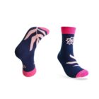 Two navy blue socks with pink accents on the toe, heel, and cuff. One sock displays a floral design, while the other shows leaf patterns. The socks are positioned to highlight their patterns and colors.