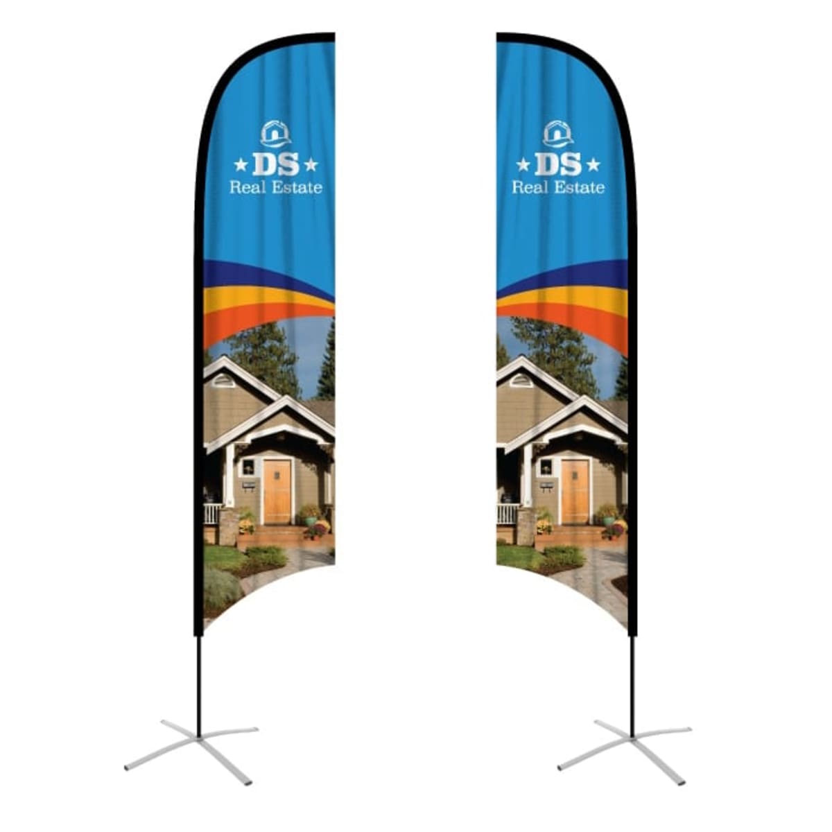 Two vertical feather flags with a DS Real Estate logo. Each flag shows an image of a house with a wooden door, surrounded by trees and plants, set against a blue sky. A red, yellow, and orange curved stripe decorates the top.