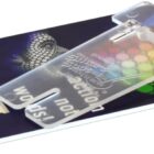 A plastic card with a colorful circular pattern and a transparent clip-on attachment. The card has text and numbers on it and features a website URL and phone number.
