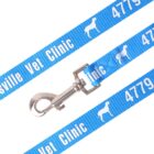 Close-up of a blue pet leash with a metal clasp, featuring the text Collinsville Vet Clinic and the numbers 4779 repeatedly printed in white. The leash also has white silhouettes of dogs and cats.