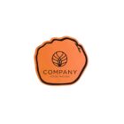 Orange badge with a stylized outline of an orange fruit. It has Company written in bold black letters, with a circular logo above and Your Tagline below it. A small leaf detail is on the top right edge.