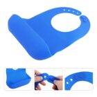Blue silicone bib with a wide pocket at the bottom. Three smaller images below show a close-up of the pocket and adjustable neck straps with buttons, highlighting the bibs features.
