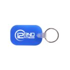 Blue rectangular keychain with rounded edges and a metal ring. The keychain features the logo 12RND FITNESS in white.