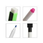 Close-up of dry erase markers in green, pink, blue, and black, each shown with the cap off.