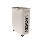 White laundry hamper on wheels with LAUNDRY written in black.