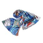 A colorful, abstract scarf with various blue, white, and red patterns, including waves and geometric shapes. It features the logo KOKOUTDOOR in dark letters on one section, and is arranged in a loose spiral on a white background.