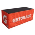 A rectangular table with an orange cover featuring the Gatorade logo, including a G and lightning bolt. The cover has GATORADE written in white, and the top of the table is black.