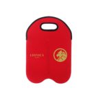 Red neoprene tote bag with a black handle, featuring a gold logo of a lion head inside a circle and the text LIONICA STUDIOS on the front. The bag has a double-compartment design.