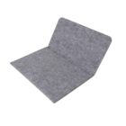 A gray, open laptop sleeve made of felt material is displayed, showing its soft texture and minimalist design. The sleeve is placed on a plain white background.