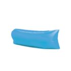 A bright blue inflatable lounger, resembling a large, air-filled cushion, is shown against a plain white background. It appears lightweight and portable, ideal for outdoor relaxation.