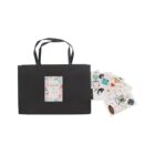 Black gift bag with Especially for you and floral design on a card. Next to it are assorted colorful stickers featuring hearts, flowers, and various patterns.