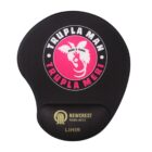 A black mouse pad with a pink circular design featuring a silhouette of a face and wings. The text reads TRUPLA MAN TRUPLA MERI ZERO 3 TASOL. Below is the Newcrest Mining Limited logo and LIHIR.