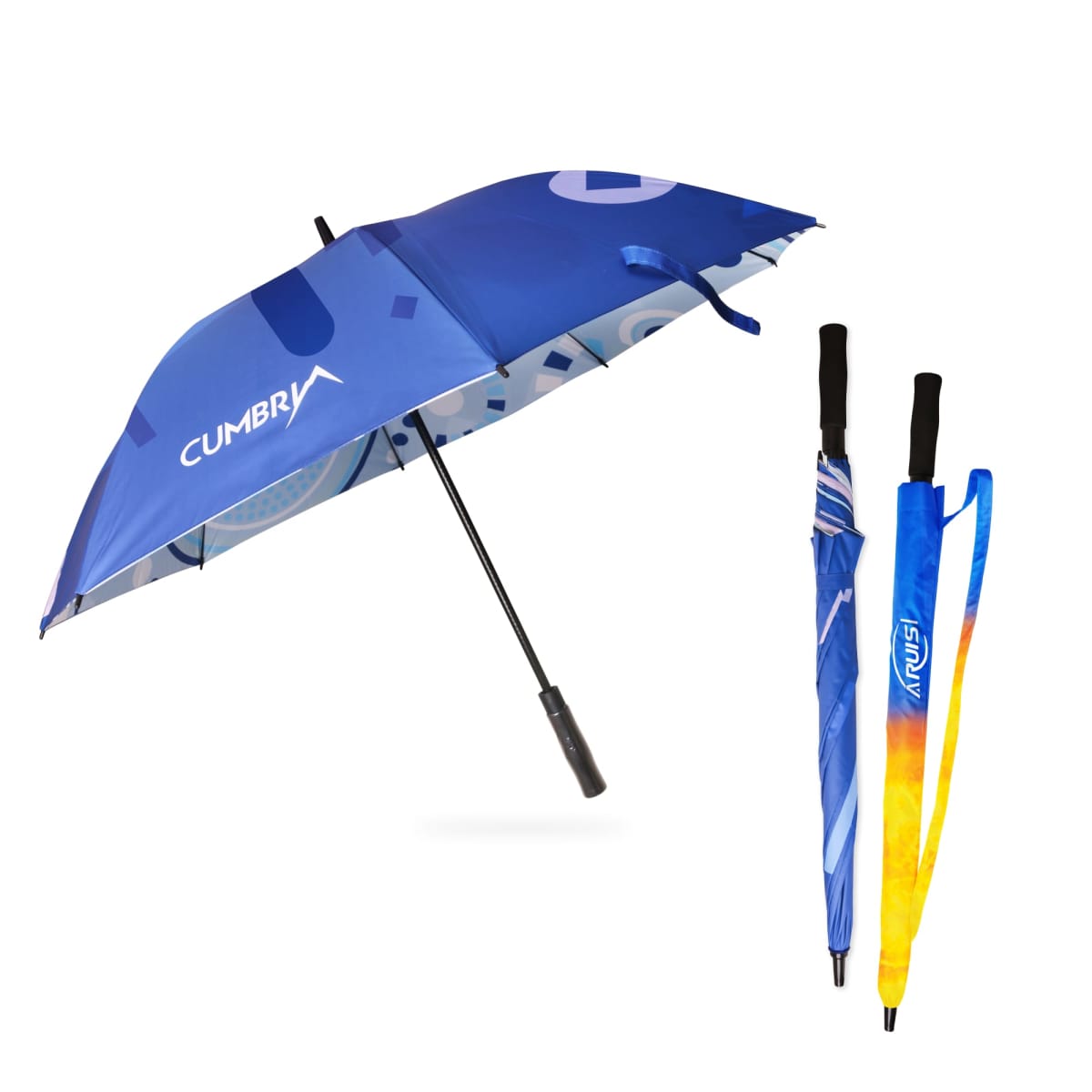 Three umbrellas are displayed. The first is open, predominantly blue with geometric patterns and the word Cumbra. The other two are closed, showcasing vibrant colors and patterns, each with a black handle.