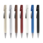 A row of seven ballpoint pens in various colors: gold, silver, bronze, red, white, blue, and black. Each pen has a metallic clip and a shiny tip, arranged vertically against a white background.