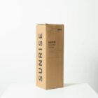 Brown cardboard box labeled SUNRISE Smoothie Tumbler with an illustration of a tumbler and straw. The box is placed on a white surface with a plain light background.