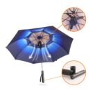 A blue umbrella shown with detailed insets. One zooms in on the internal frame, highlighting the ribs, while the other shows a close-up of the detachable handle mechanism. The umbrella interior is illuminated with a soft glow.
