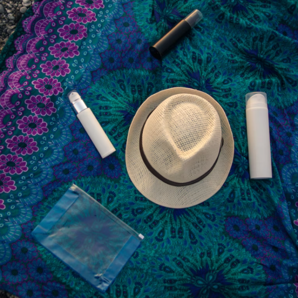 Blue and violet mat with sunscreens and a hat