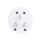 Close-up of a white electrical plug adapter with three metallic prongs. The adapter has a round shape and is viewed from the side with the prongs facing outward.