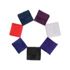 A circle of seven neatly folded pocket squares in different colors: navy blue, purple, white, dark blue, black, royal blue, and red. The squares are evenly spaced against a plain white background.