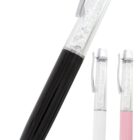 Three ballpoint pens with silver clips and crystal-filled upper halves. The pens have black, white, and pink lower halves, showcased against a white background.