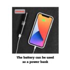 A smartphone with a colorful wallpaper is connected to a small cylindrical power bank showing 2600mAh capacity. The background is a dark surface, and a caption below reads, The battery can be used as a power bank.
