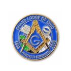 Circular emblem with a blue background showing the Freemason square and compass symbol, an astronaut, and a rocket. Text reads Grand Lodge of Ohio and Pioneers to Astronauts 1808-2008.