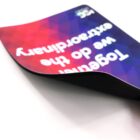 Curved, colorful sign reads Together we do the extraordinary.