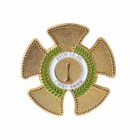 A gold medal in the shape of a four-blade propeller with a green laurel wreath encircling a central circle. Text 2015.12.06 is above, with additional text below in an unidentified script.