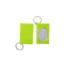 Two lime green keychains are shown. One has a closed rectangular cover, while the other is open, revealing a mirror inside. Both have metal key rings attached.