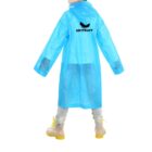 Person in a blue raincoat with ABSTRACT logo, wearing clear boots with yellow soles.