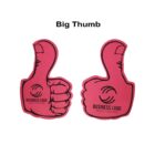 Two pink foam thumbs up with the text Business Logo: Your Tagline printed on them. Above the thumbs, black text reads Big Thumb. The thumbs have cartoon-like outlines on a white background.