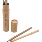 A recycled cardboard cylinder with Greenhill Estates printed on it, containing two pencils with erasers. The lid is beside it, and below are a ballpoint pen and an additional pencil, both in similar eco-friendly designs.