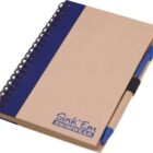 A spiral-bound notebook with a brown cover and blue accents. The words Sink Em Swimwear are printed in blue on the bottom right. A blue and brown pen is attached to the notebook with a black holder.