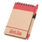 A small notepad with a red top spiral binding and a matching red and brown pen attached on the side. The cover features the text Sink Em Swimwear in red at the bottom.