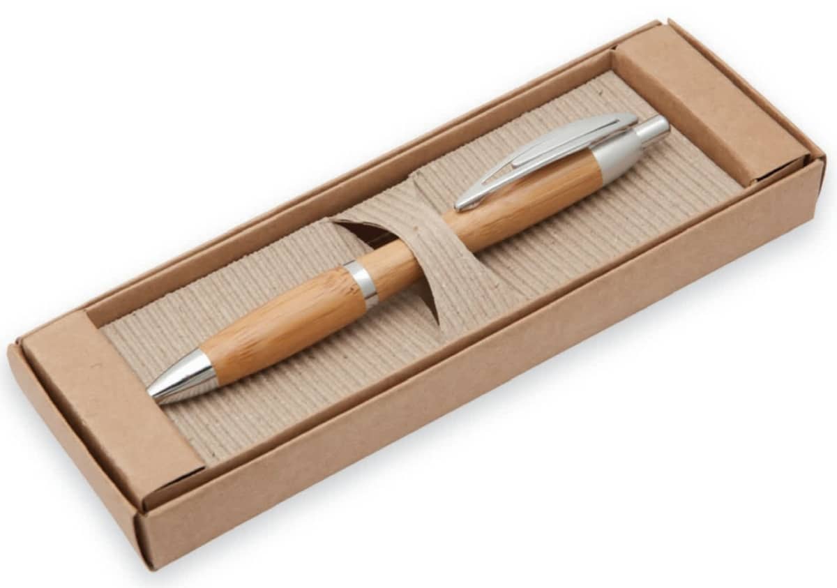 A bamboo pen with silver accents is neatly presented in an open cardboard box with a textured insert.
