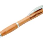 A wooden ballpoint pen with shiny silver accents and a clip. The pen is engraved with the text Total Filters.
