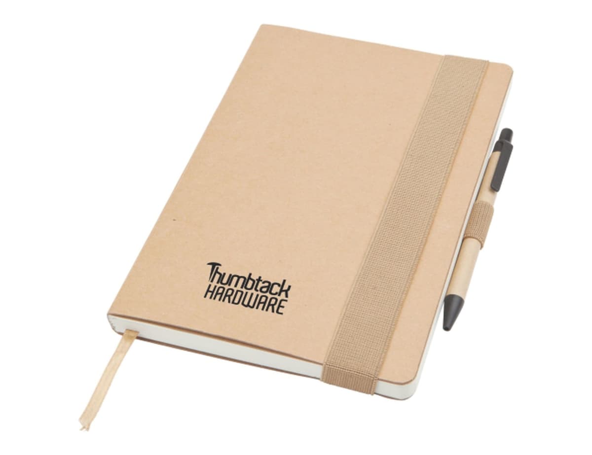 A brown hardcover notebook with Thumbtack Hardware printed on it. It has an elastic strap, a ribbon bookmark, and a pen attached to the side.