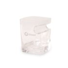 A transparent, uniquely shaped glass with an ergonomic grip indentation, branded with a doxer logo. The glass has a square base and a smooth, rounded design on top, perfect for holding beverages stylishly.