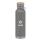 A gray insulated water bottle with a wooden lid and a metal handle is displayed upright. The bottle has a white logo and the text AIPM printed on it.