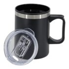 A black travel mug with a handle and a stainless steel rim is shown. The transparent plastic lid, designed with a sliding opening for sipping, is placed leaning against the mug. The mug features a double-walled insulated design.